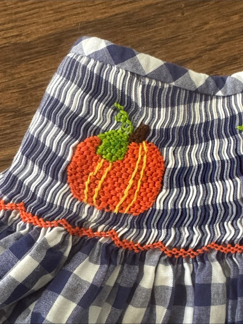 Cecil And Lou Navy Gingham Smocked Dress with Smocked Orange Pumpkin Embroidery